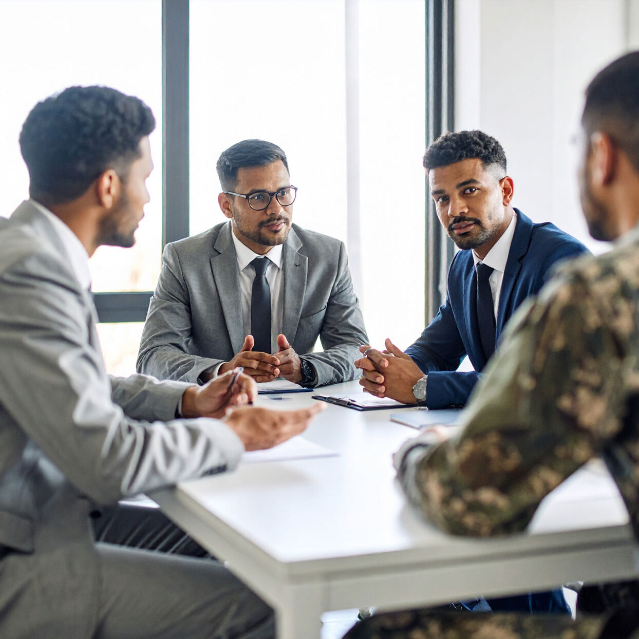 business-meeting-between-business-men-and-military-personel,-seating-at-a-conference business-meeting-between-business-men-and-military-personel,-seating-at-a-conference